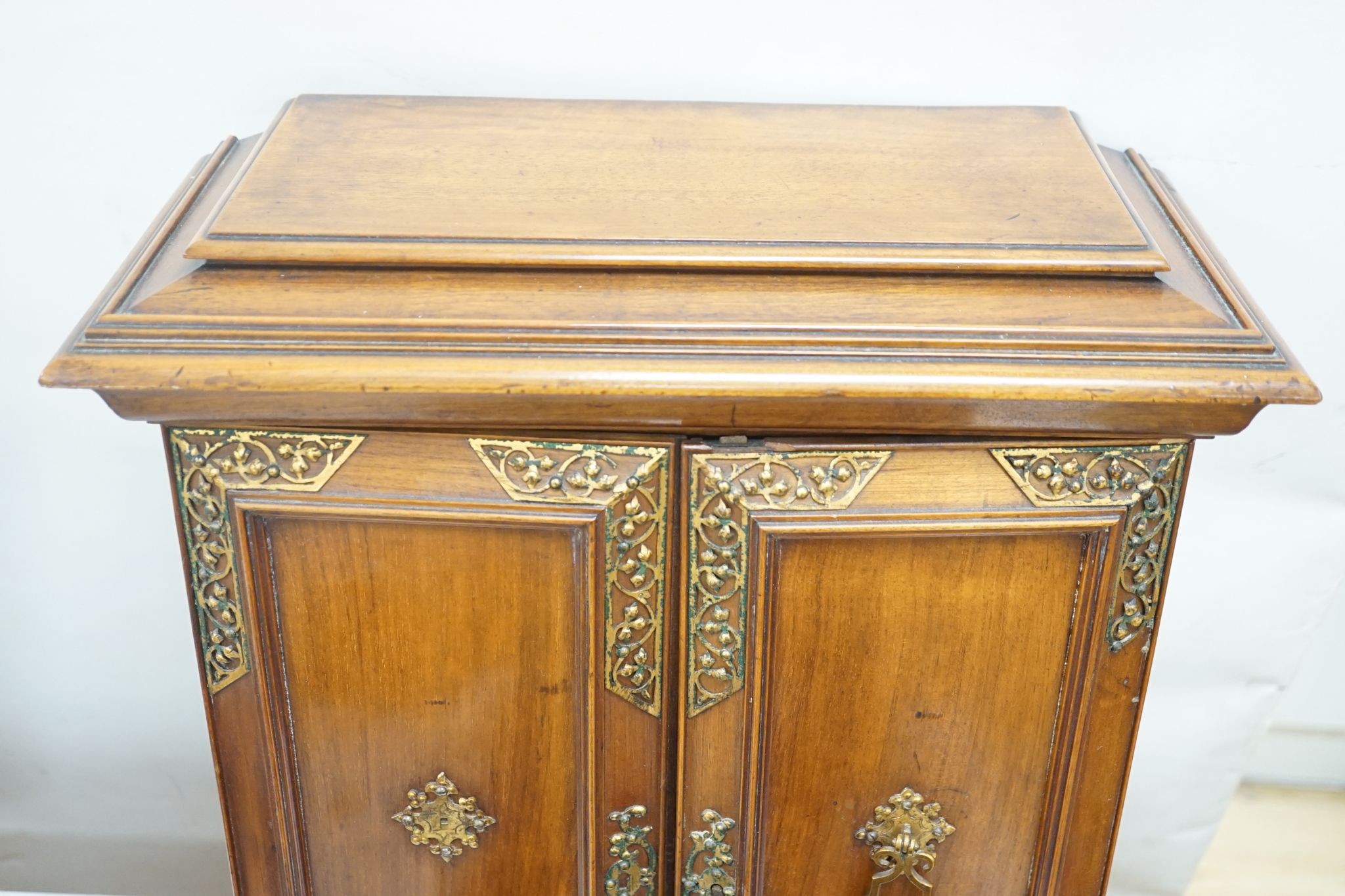 A late 19th century gilt metal mounted walnut games cabinet, W.40cm D.19cm H.49cm